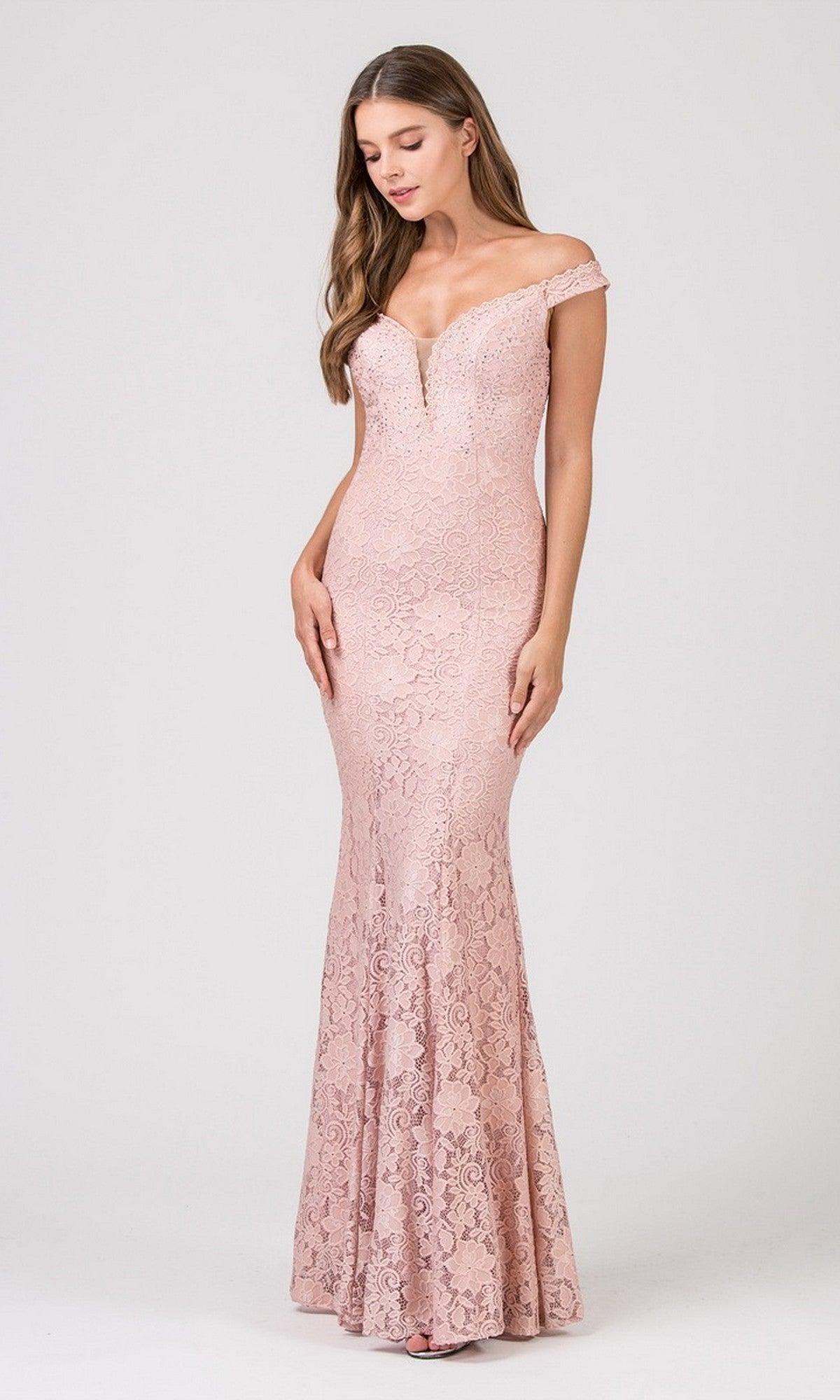 A woman models the Eureka 8050 Long Prom Dress in dusty pink, an off-the-shoulder lace gown with delicate details and floor-length elegance, set against a simple light background.